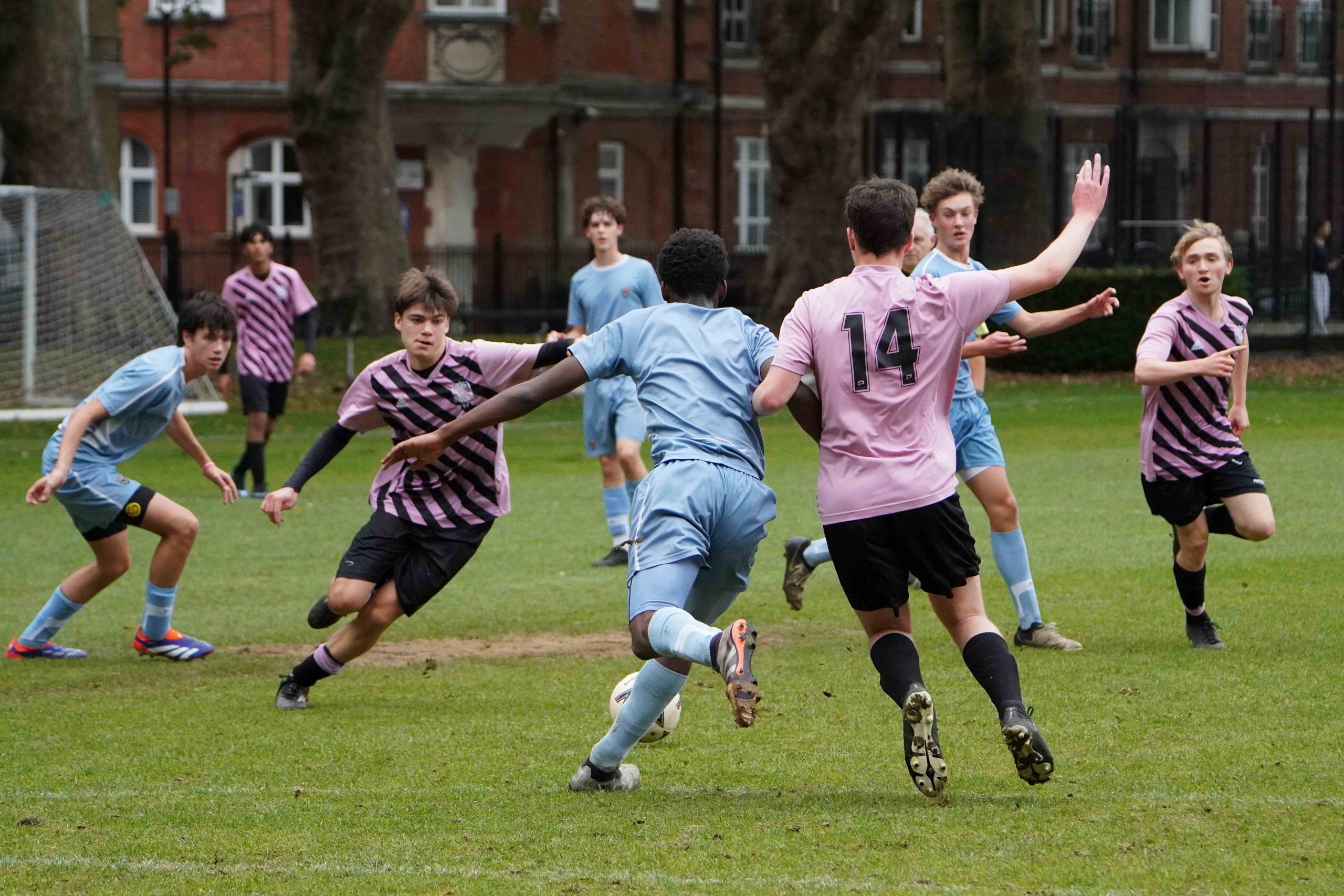 A boys group football tackle