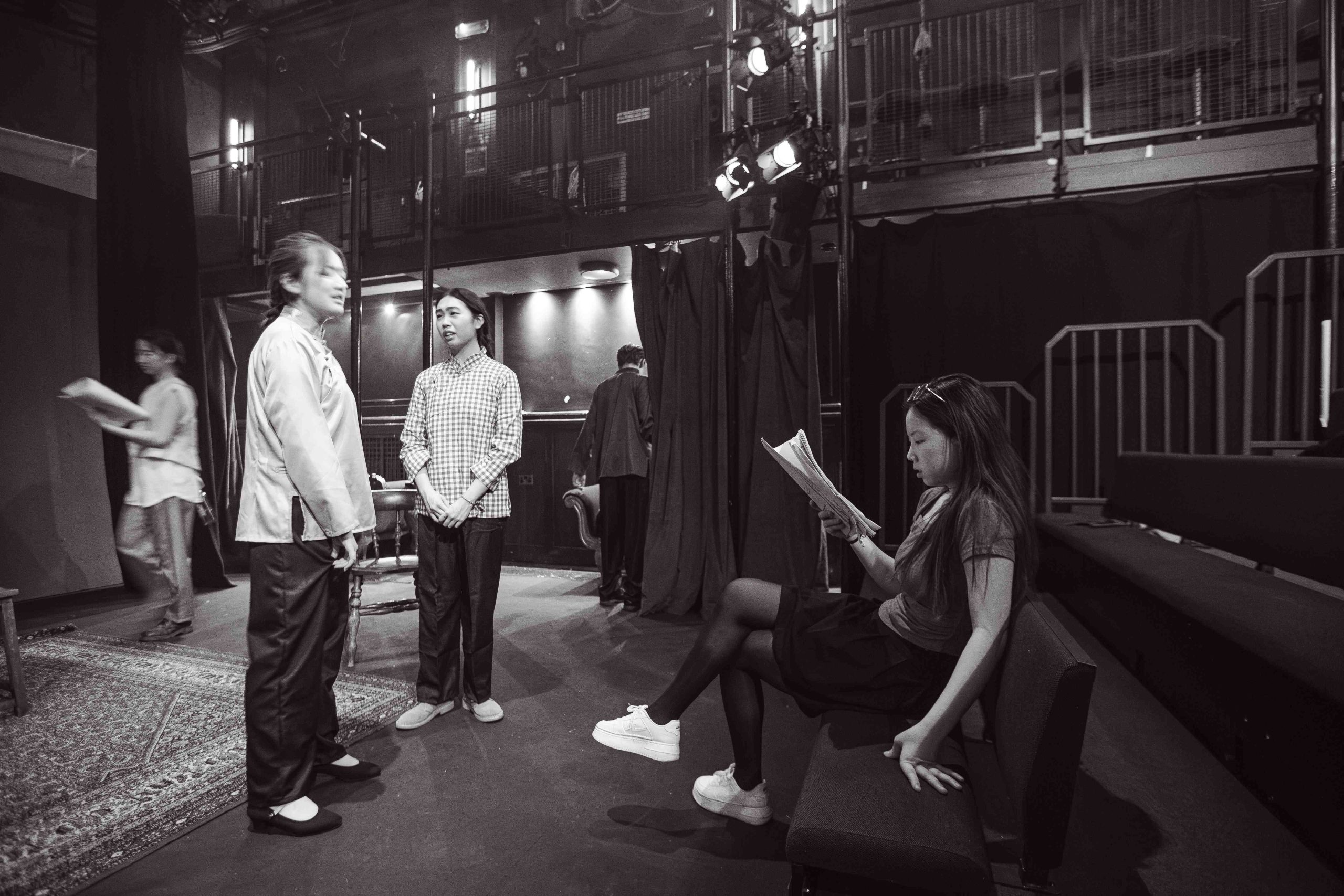 Two girls listening to instructions from a director