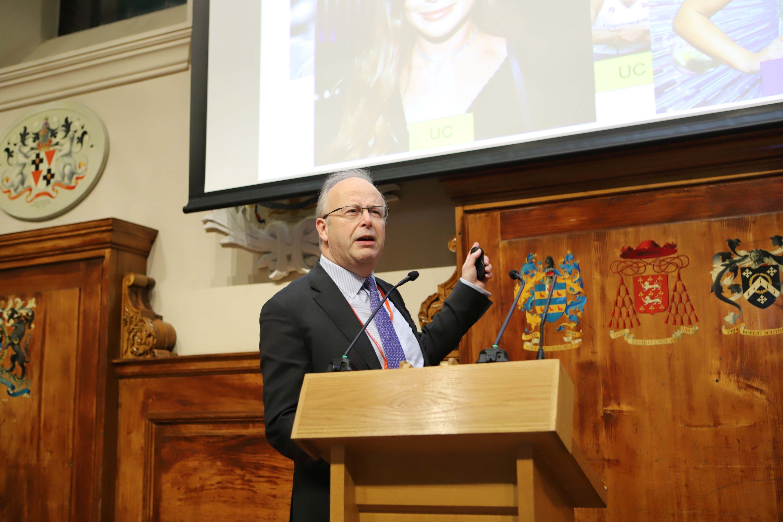 Professor Tom Orchard CBE speaking at a lectern in a Locke Lecture
