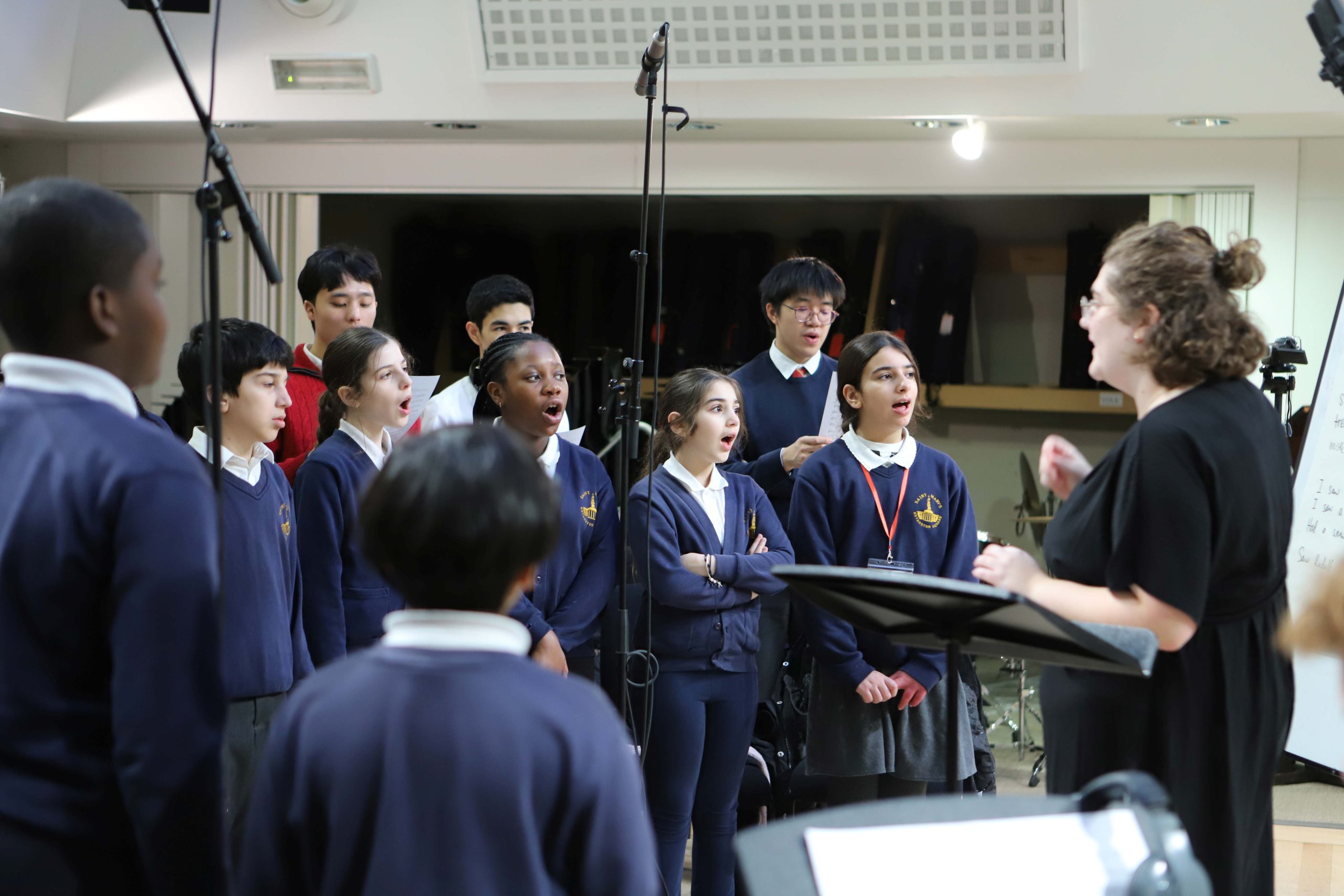 Pupils from a local primary school singing in the music department