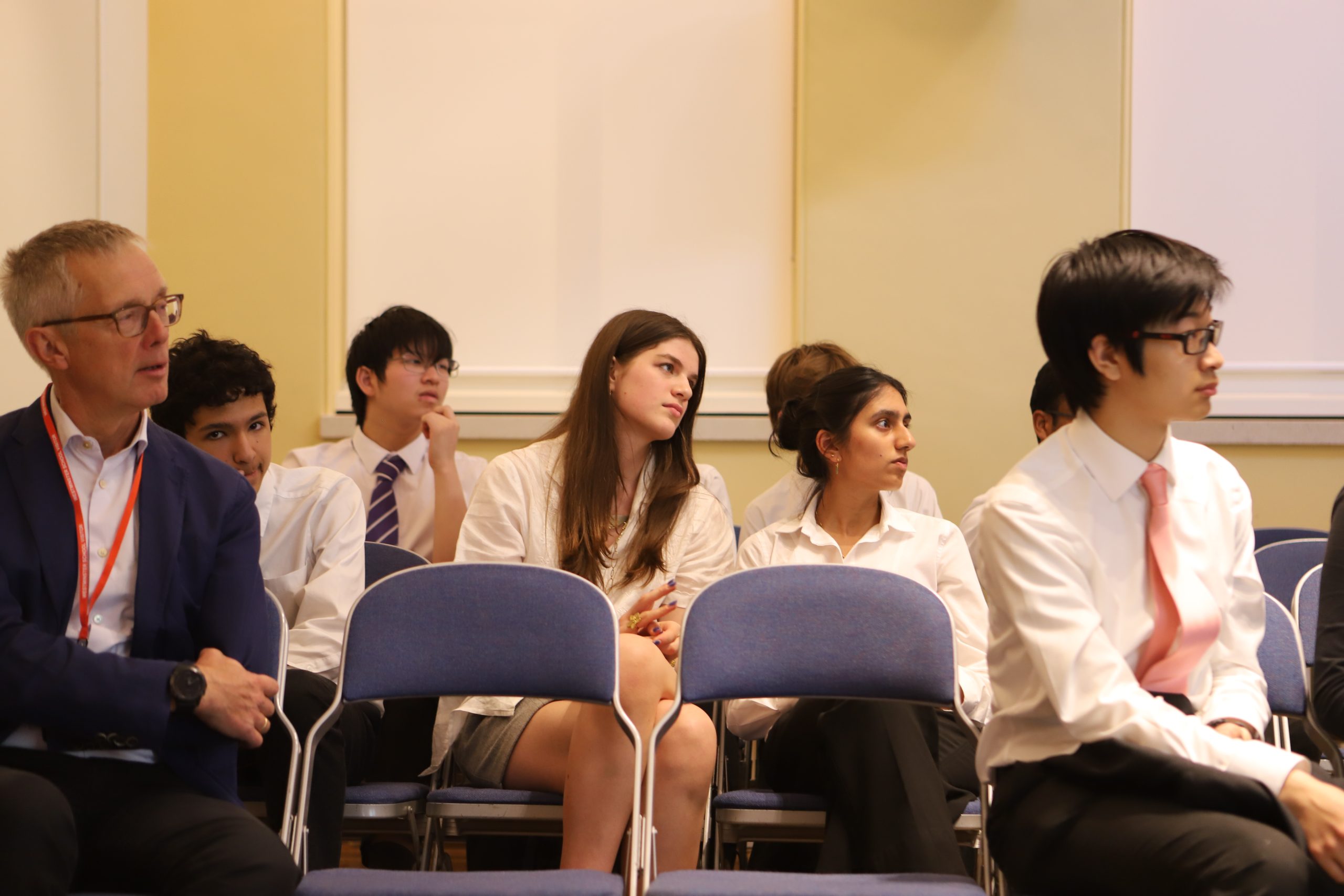Two female pupils watching the talk