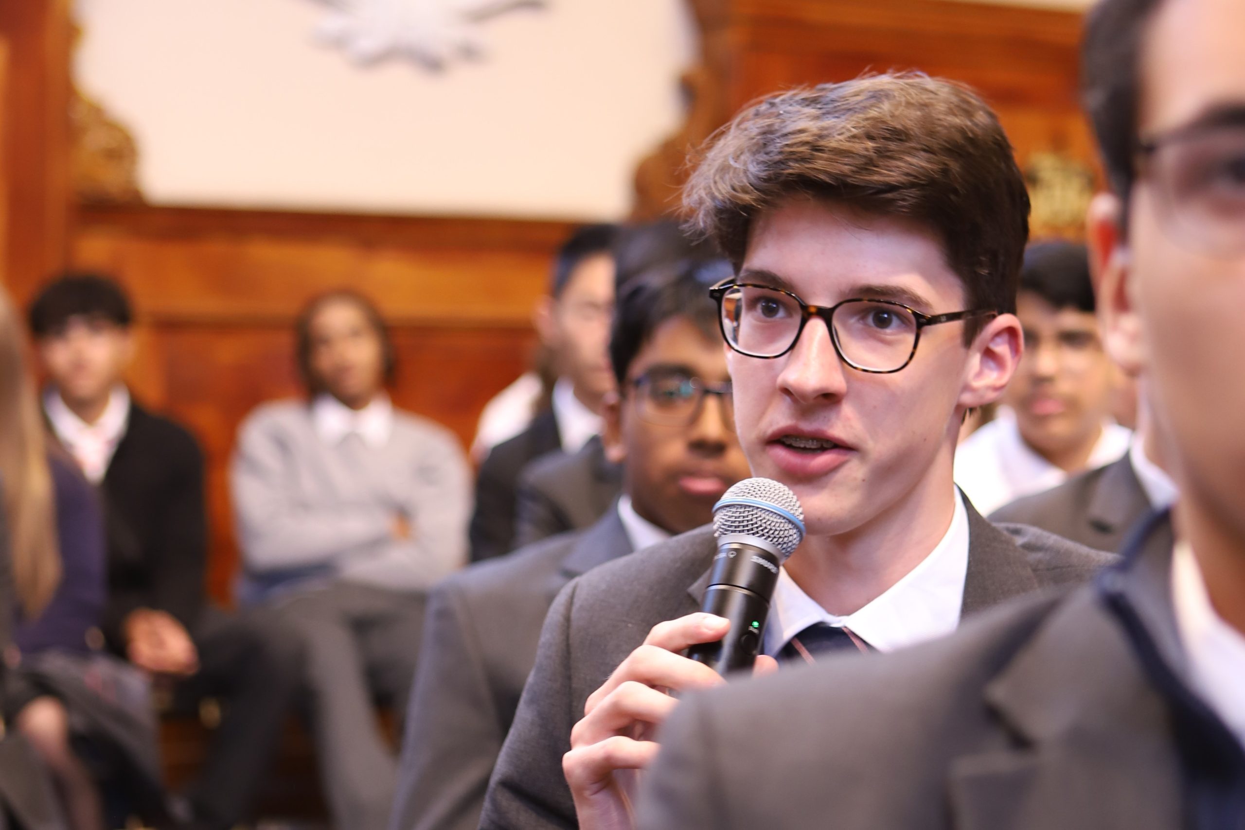 A boy asking a question in the Q&A session following Bijan Omrani's talk on his new book 'God is an Englishman' at Westminster School