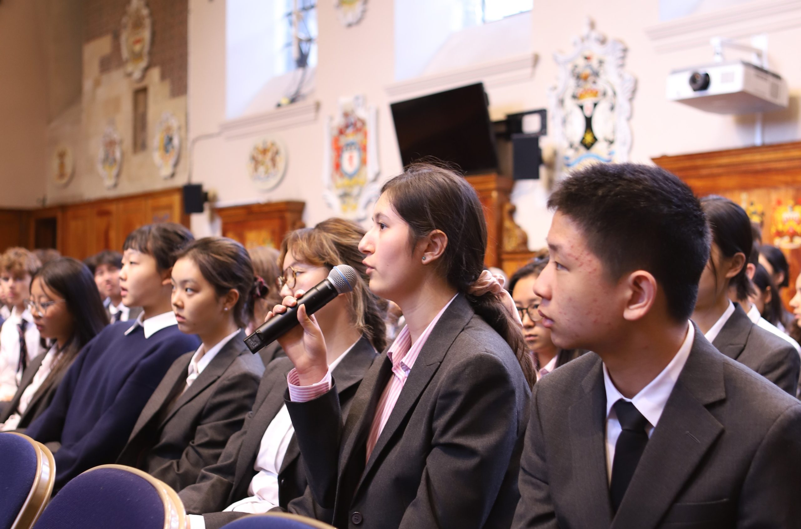 A girl asking a question in the Q&A session following Bijan Omrani's talk on his new book 'God is an Englishman' at Westminster School