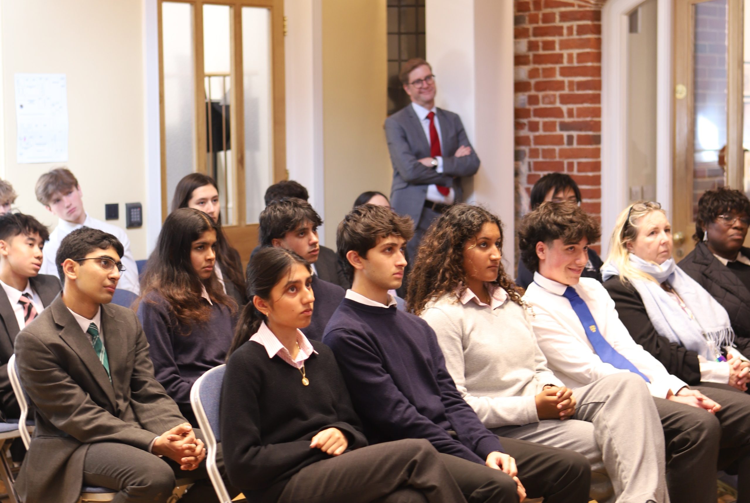 Audience of boys and girls and the Head Master