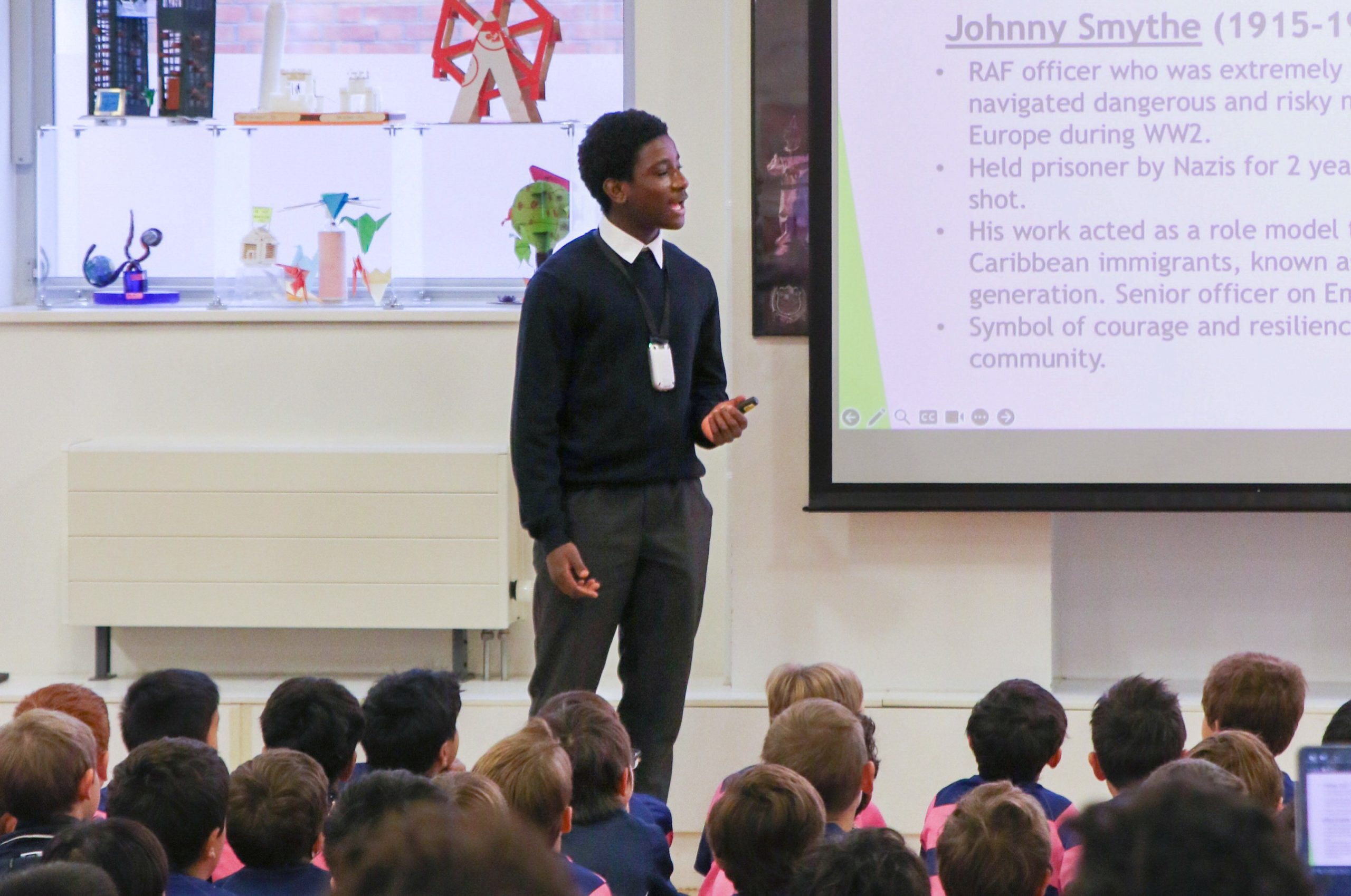 Sixth Form pupil leading BHM assembly on stage at Westminster Under School