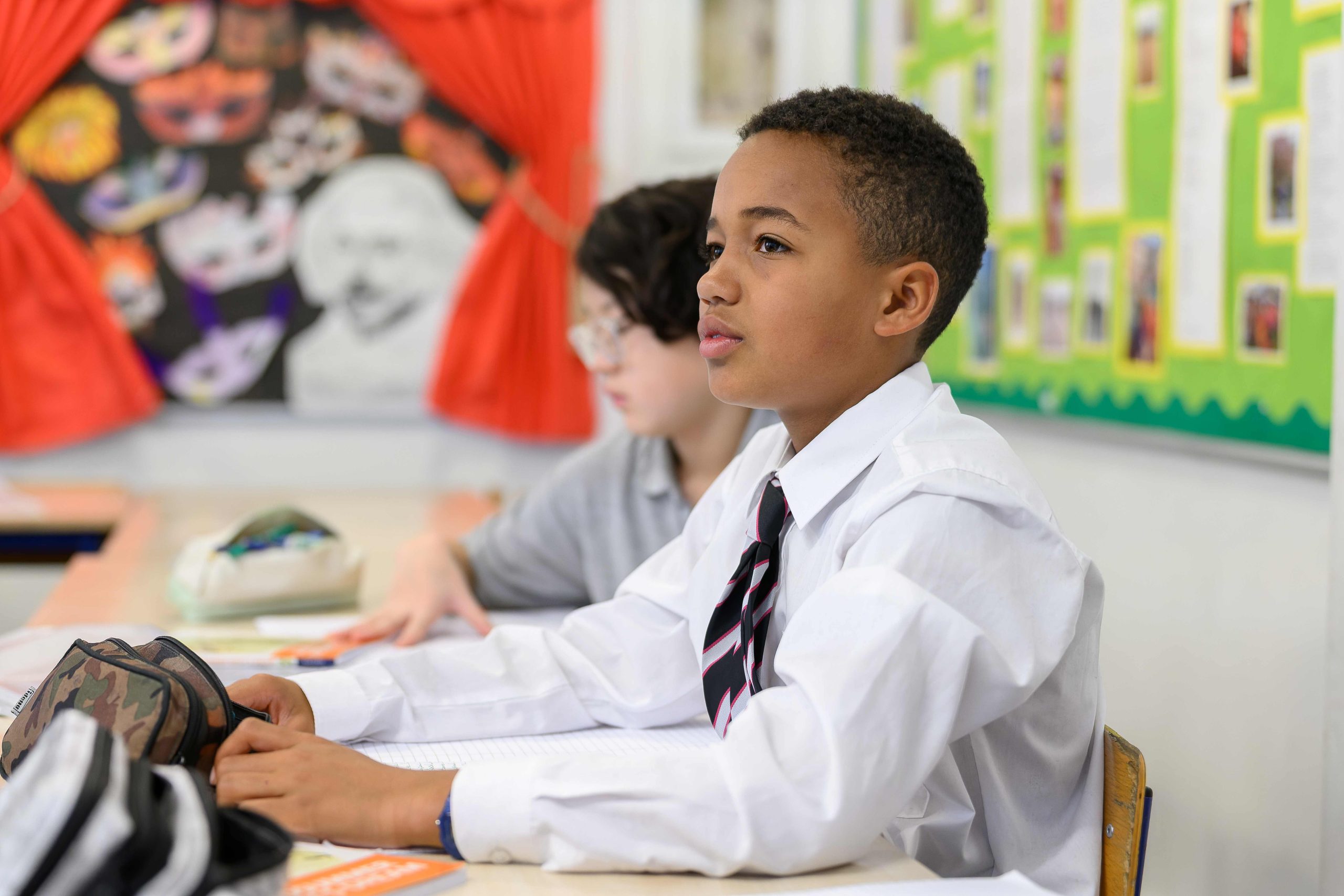 Two Westminster Under School boys sat at a desk in class