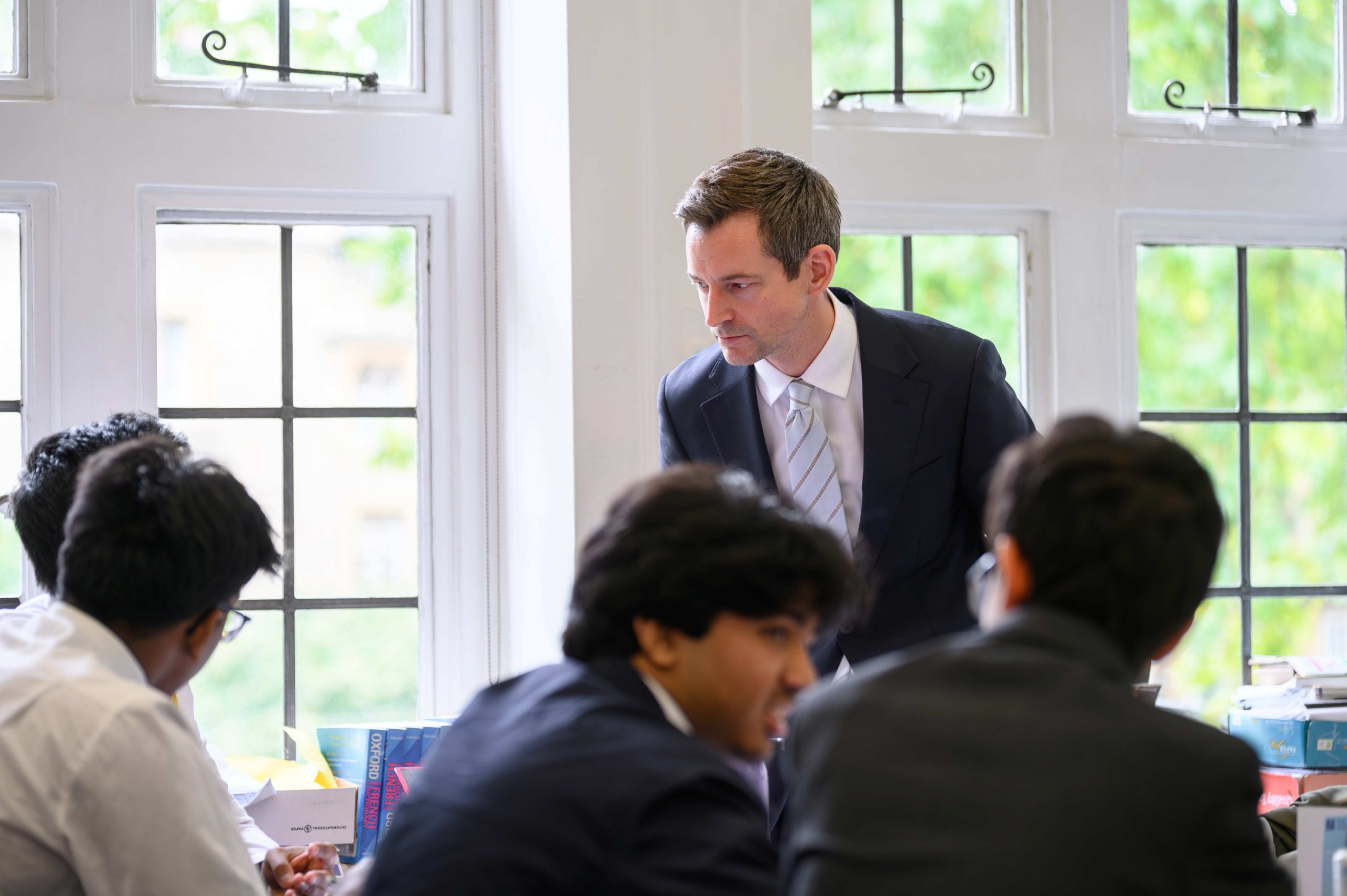 A Wellbeing teacher discussing content with pupils