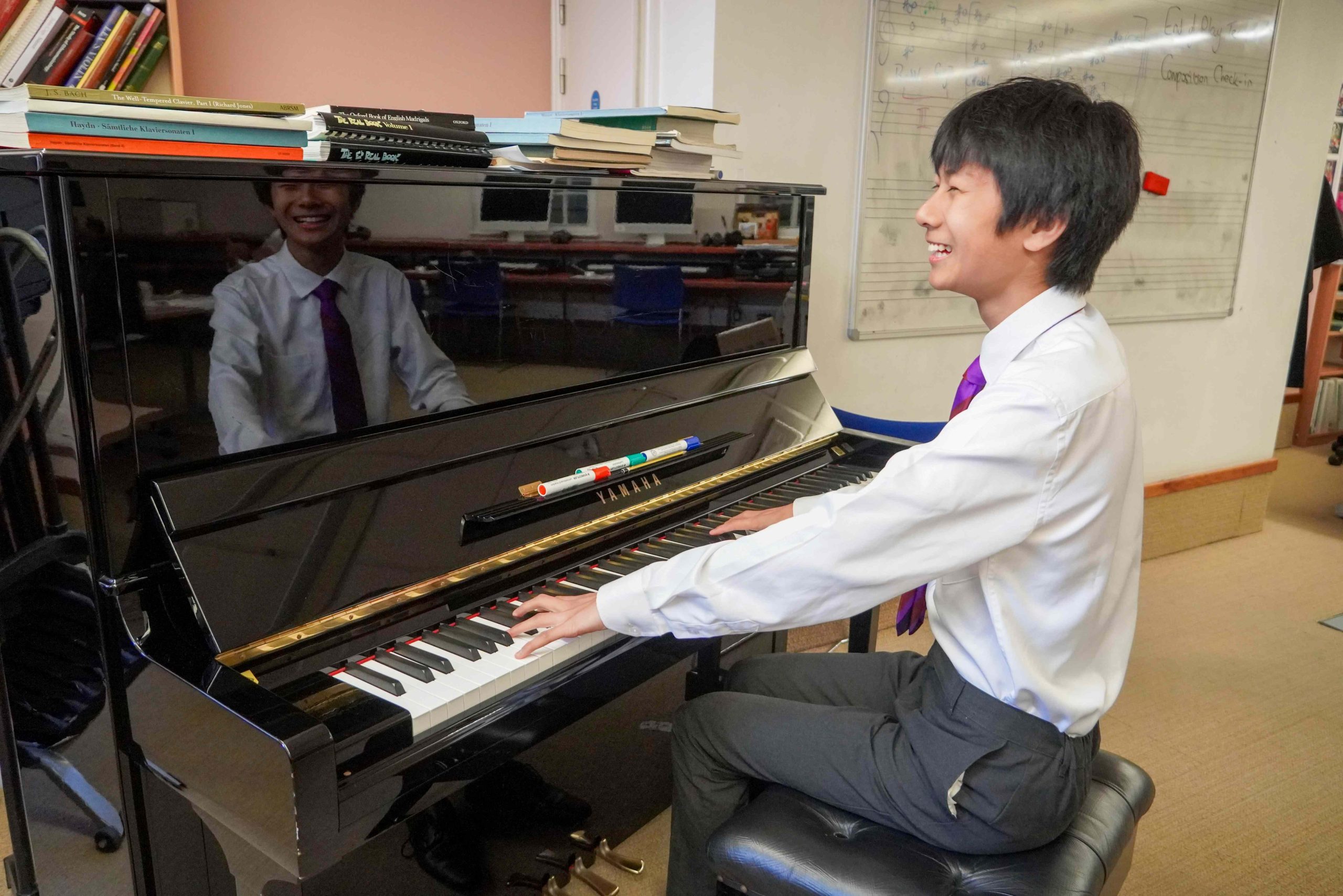 Jixuan playing the piano in the School's Music Department