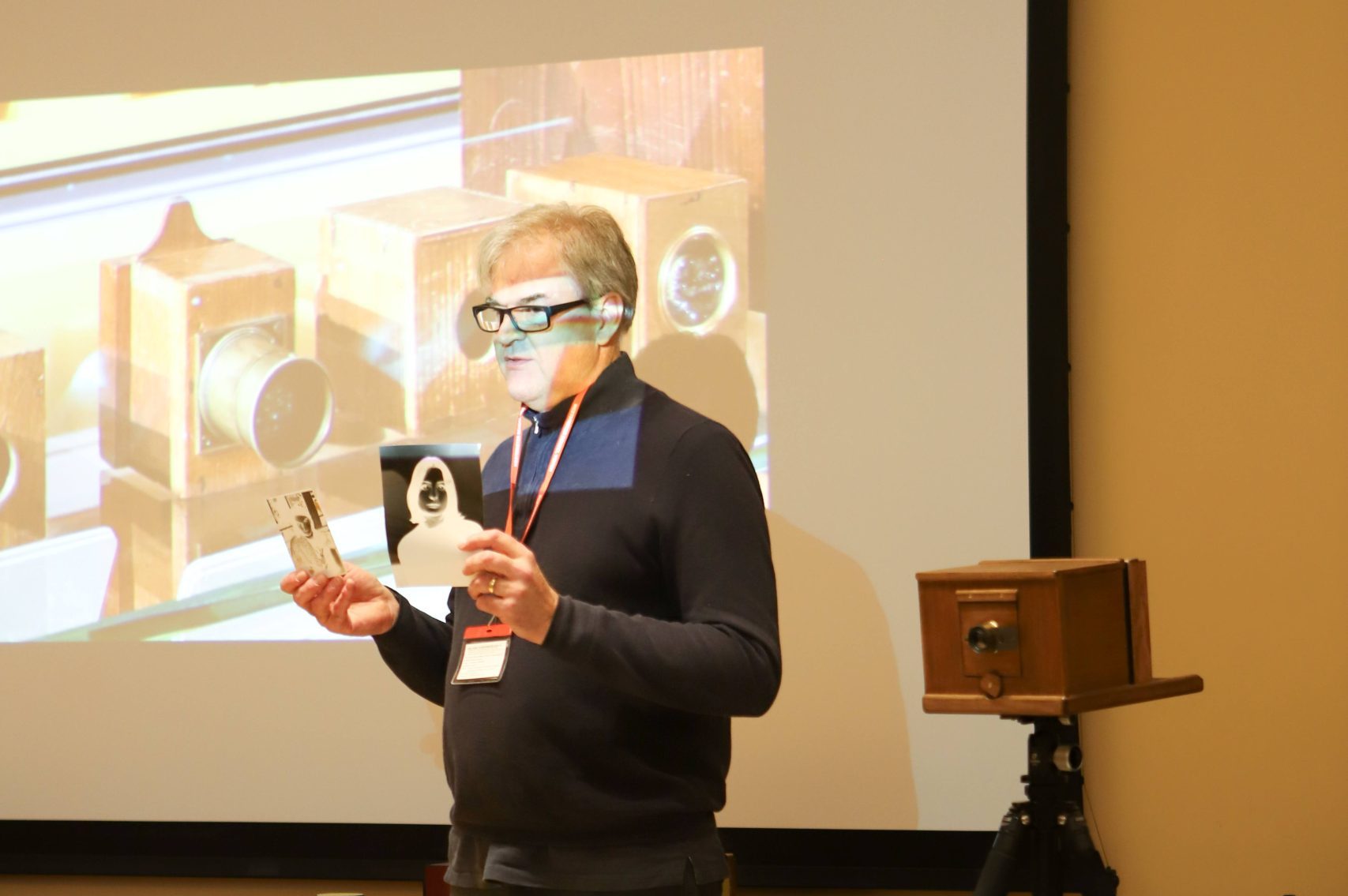 Pete Swann showing the group the antique box camera
