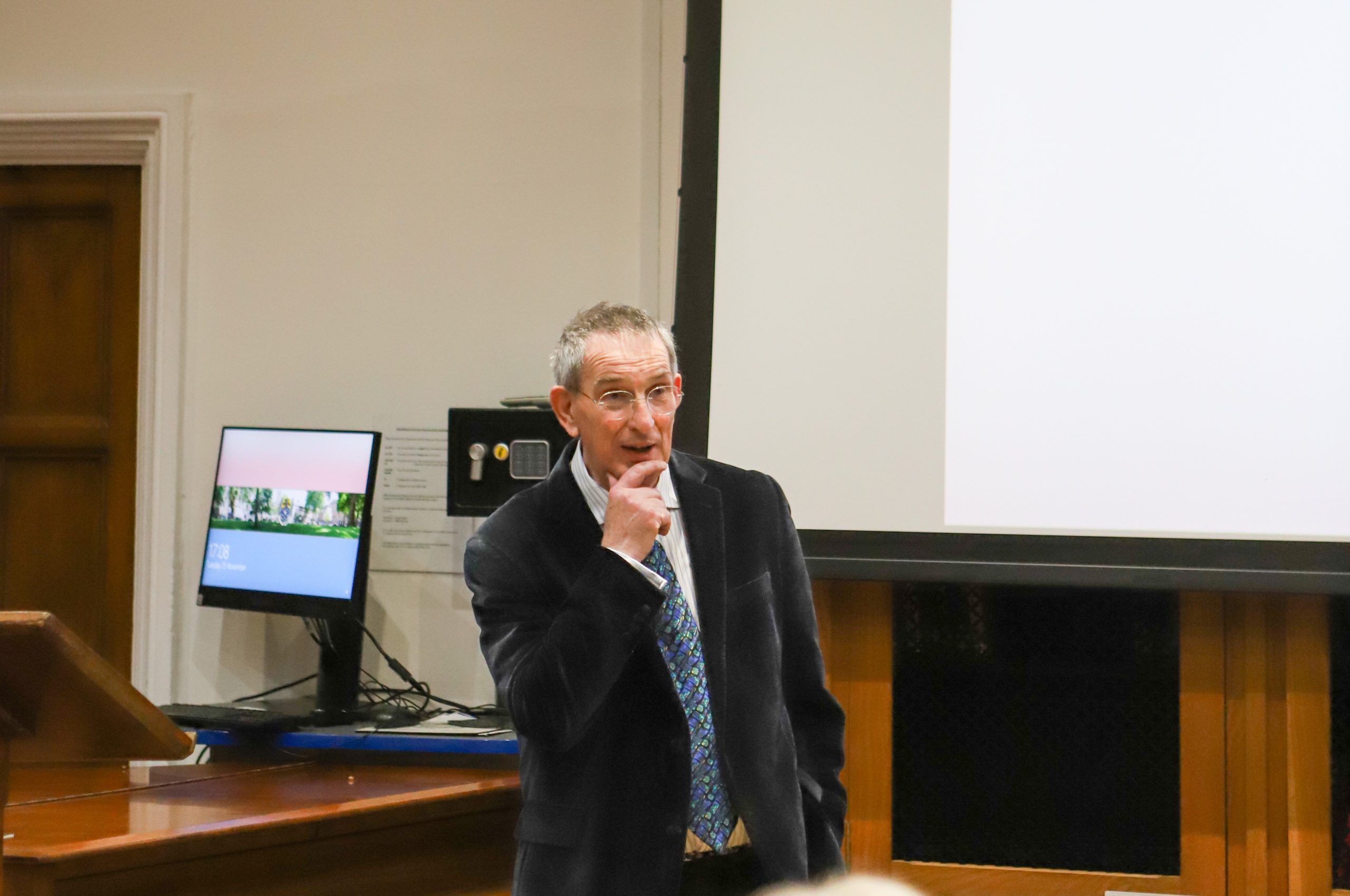 Professor Lockwood speaking, hand to mouth