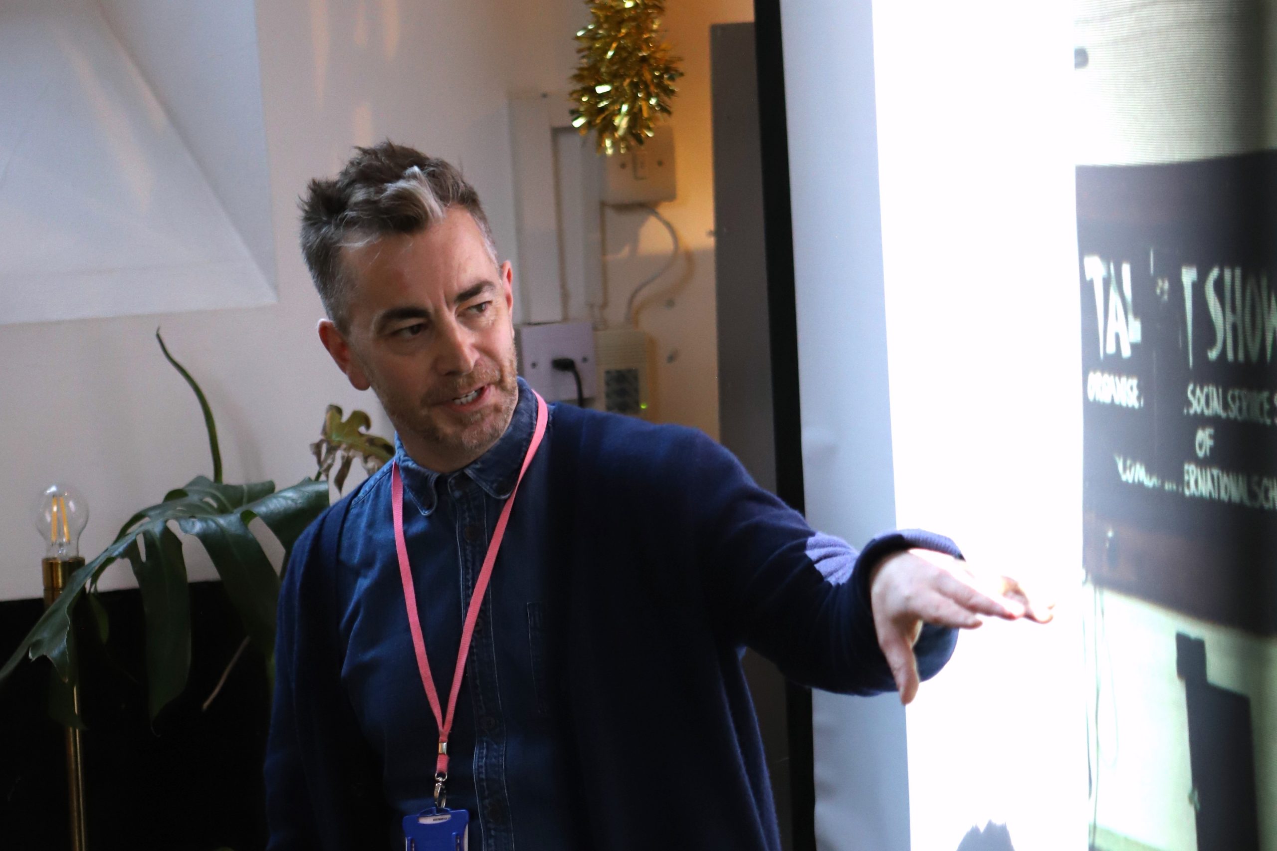 Chris in front on the screen explaining something